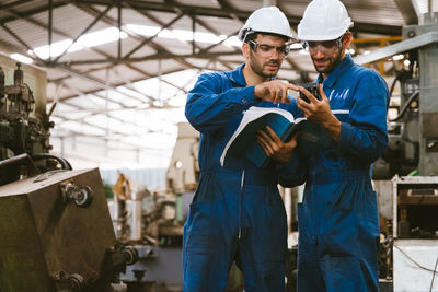 Low angle view of man standing in factory