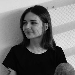 Portrait of woman against wall