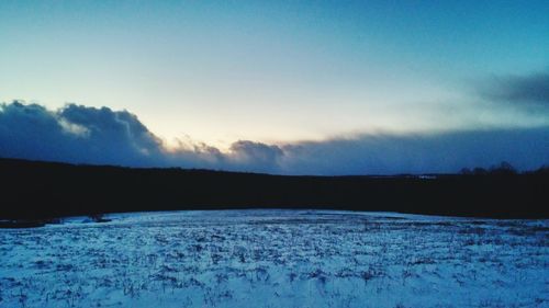 Scenic view of snow covered mountain against sky