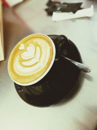 Close-up of coffee cup on table