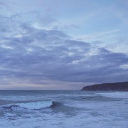 Scenic view of sea against blue sky