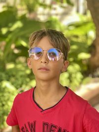 Portrait of young boy wearing sunglasses