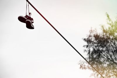 Low angle view of swing against sky