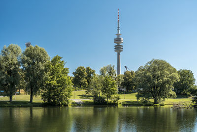 View of trees and tower against sky