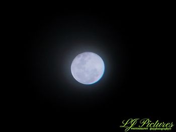 Low angle view of moon against sky at night