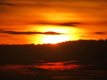 Scenic view of dramatic sky during sunset