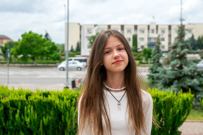 Portrait of young woman looking away