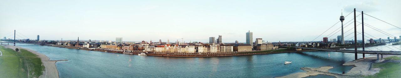 Panoramic view of river and buildings against sky