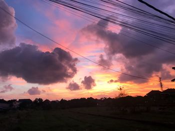 Silhouette trees against sky during sunset