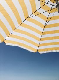 Low angle view of umbrella against sky