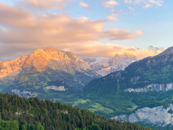 Scenic view of mountains against sky during sunset