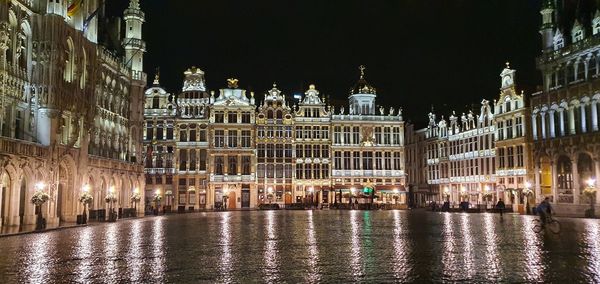 Illuminated buildings in city at night