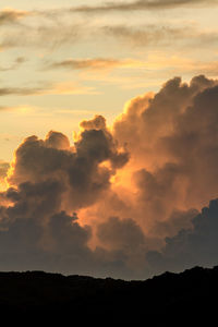 Low angle view of silhouette landscape against sky during sunset