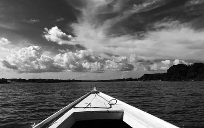 Boat sailing in sea against sky