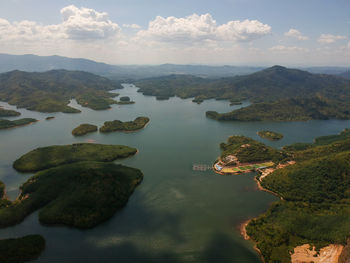 Scenic view of lake and mountains against sky