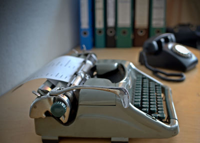 Close-up of machine part on table