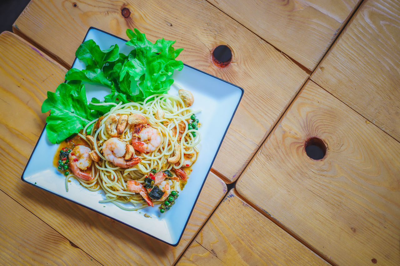 HIGH ANGLE VIEW OF SALAD SERVED ON TABLE