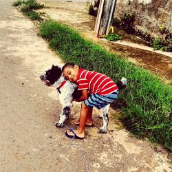 High angle view of woman standing with dog