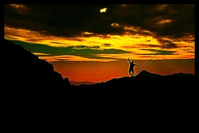 Silhouette woman against sky during sunset
