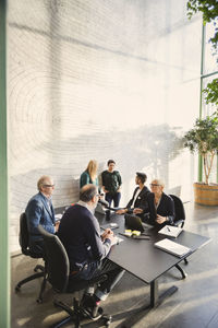 Multi-ethnic business people discussing in creative office