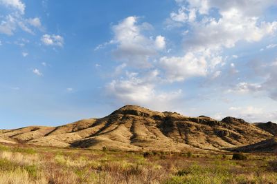 Scenic view of arid landscape against sky