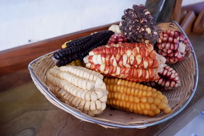 Close-up of corns in basket on table