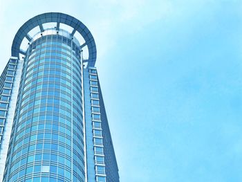 Low angle view of skyscrapers against clear blue sky