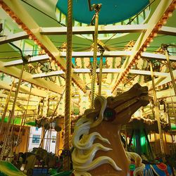 Low angle view of carousel at amusement park