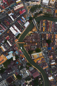 Aerial view of river and houses in city