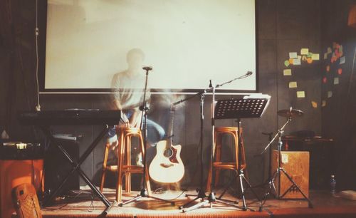 Digital composite image of musician in studio