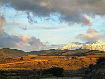 Scenic view of landscape against cloudy sky