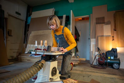 Young man working at workshop