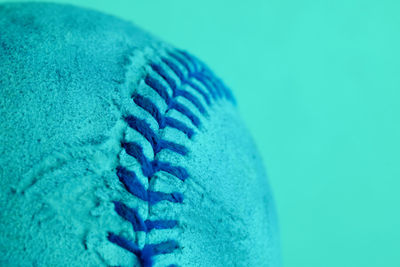 Close-up of rope over blue background