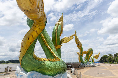 Statue against yellow sky