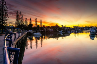 Scenic view of river against orange sky