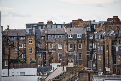 Buildings in city against sky