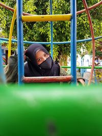 Portrait of girl playing in playground