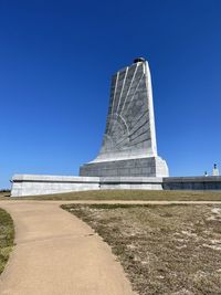 Low angle view of historical building against blue sky