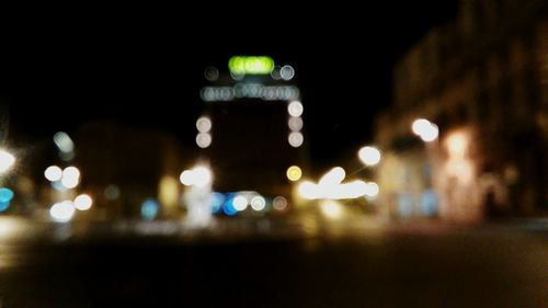 Defocused image of illuminated city at night