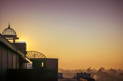 Low angle view of building at sunset