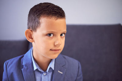 Close-up portrait of boy at home