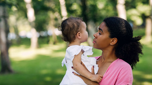 Mother and daughter outdoors