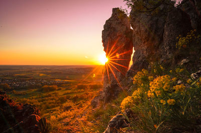 Scenic view of landscape against sky during sunset