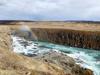 Scenic view of river amidst rock formation against sky