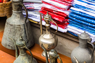 Close-up of clothes hanging on table by building