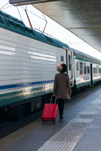 Tourist woman going for vacation trip on train