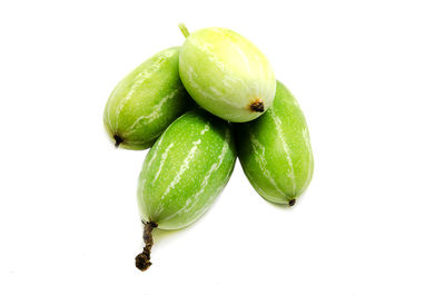 Close-up of fruit over white background