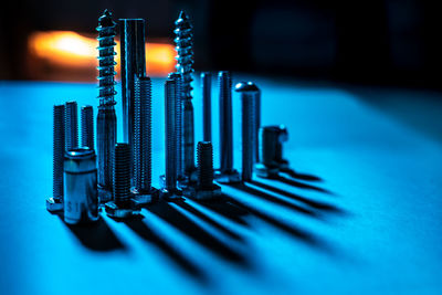 Close-up of illuminated lighting equipment on table