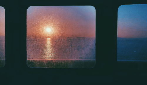 Close-up of illuminated window during sunset