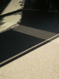 High angle view of sunlight falling on street